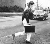 Student dodging traffic on the Auraria Campus